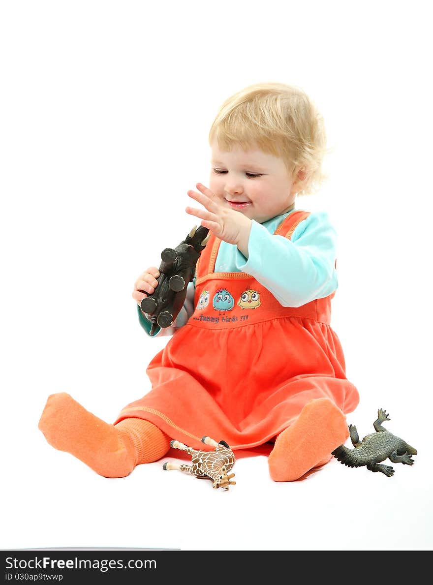 A Baby Playing With Toy Animals Isolated On White