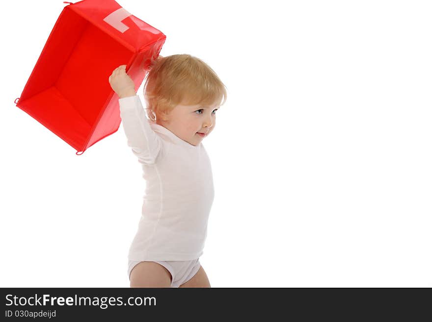 1 year old baby throwing red box isolated on white