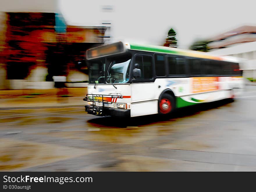 A public bus rounding a corner. A public bus rounding a corner.