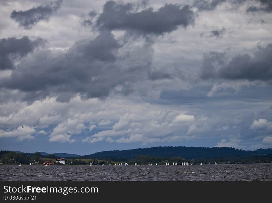 Clouds over the lake Lipno, with sails