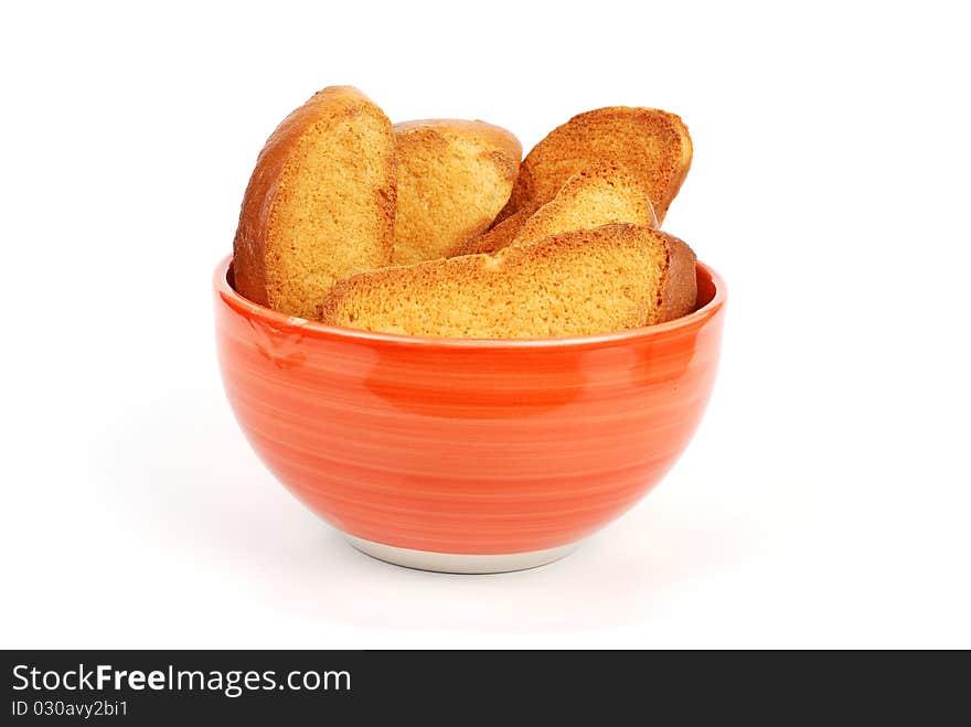 Orange bowl with crackers on a white background