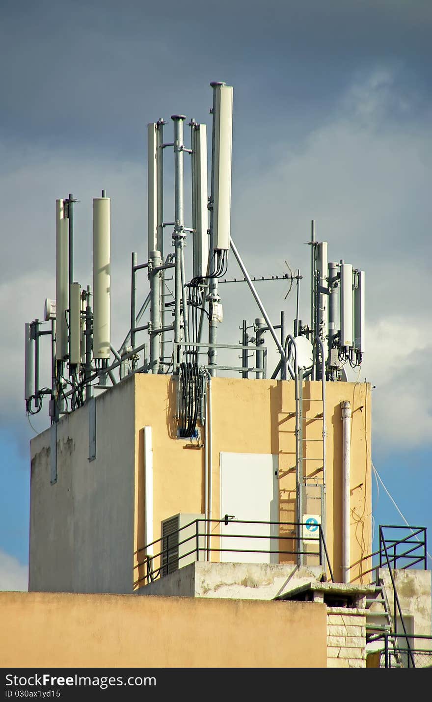 Mobile Telephone Antennas installed on the top of a building