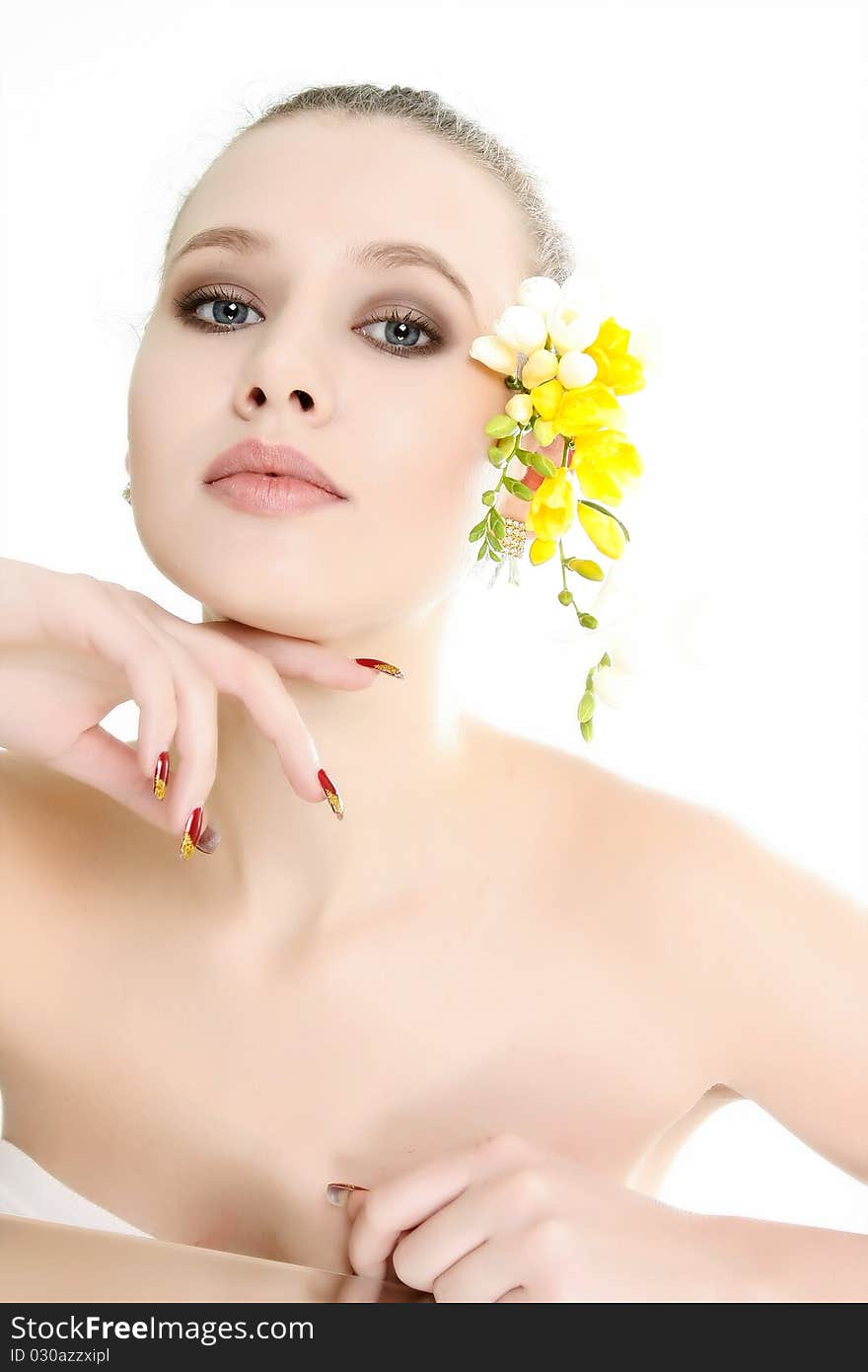 Young beautiful woman with flowers over white