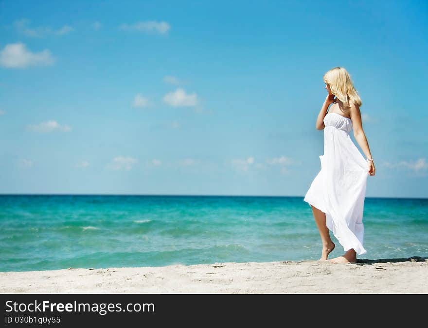 Young romantic woman on beach