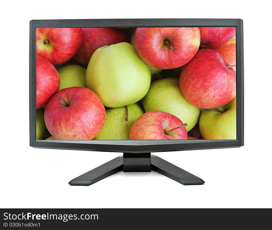 Monitor isolated on white background with red and green apples on the screen. Monitor isolated on white background with red and green apples on the screen