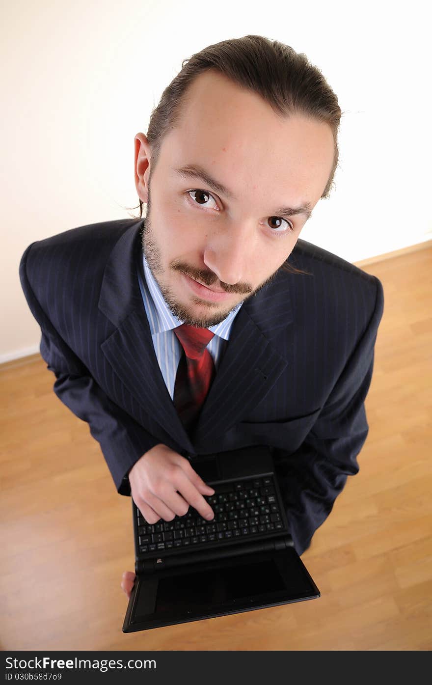 Portrait of a young successful business person in the office. Portrait of a young successful business person in the office