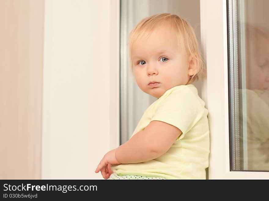 Girl sitting on the window sill