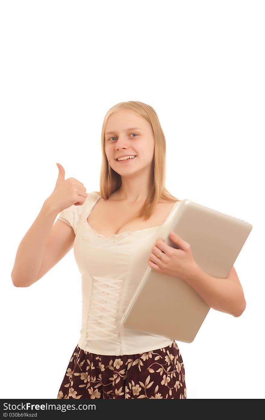 Portrait of Young adorable businesswoman giving the thumbs up sign and holding silver laptop on white