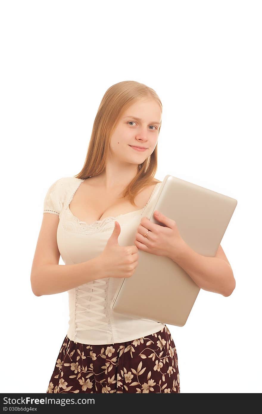 Portrait of Young adorable businesswoman giving the thumbs up sign and holding silver laptop on white. Portrait of Young adorable businesswoman giving the thumbs up sign and holding silver laptop on white