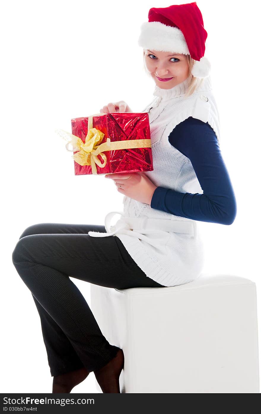 Christmas girl sits and hold a gift