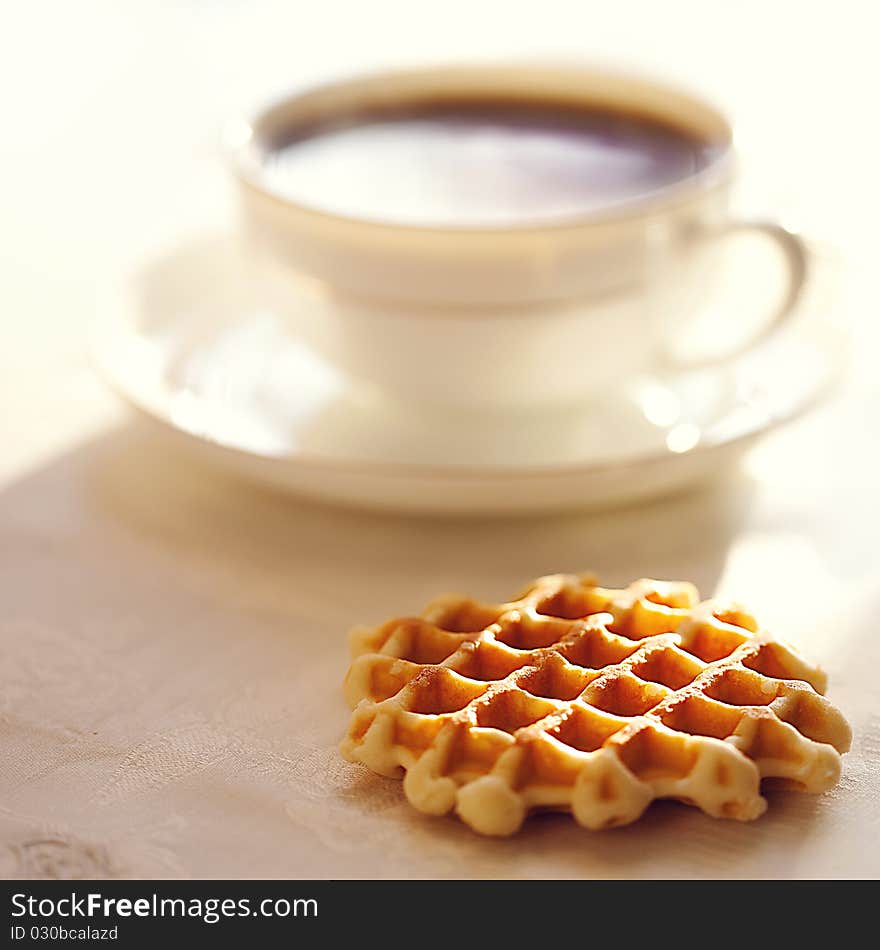 Hot coffee with wafers, close-up