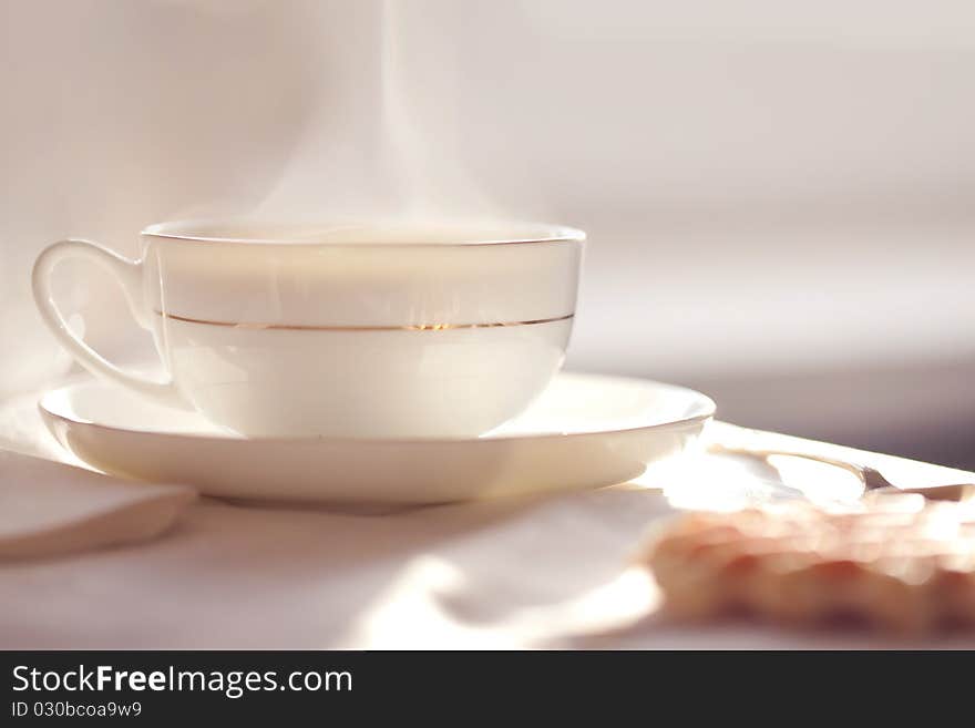 Hot coffee with wafers, close-up