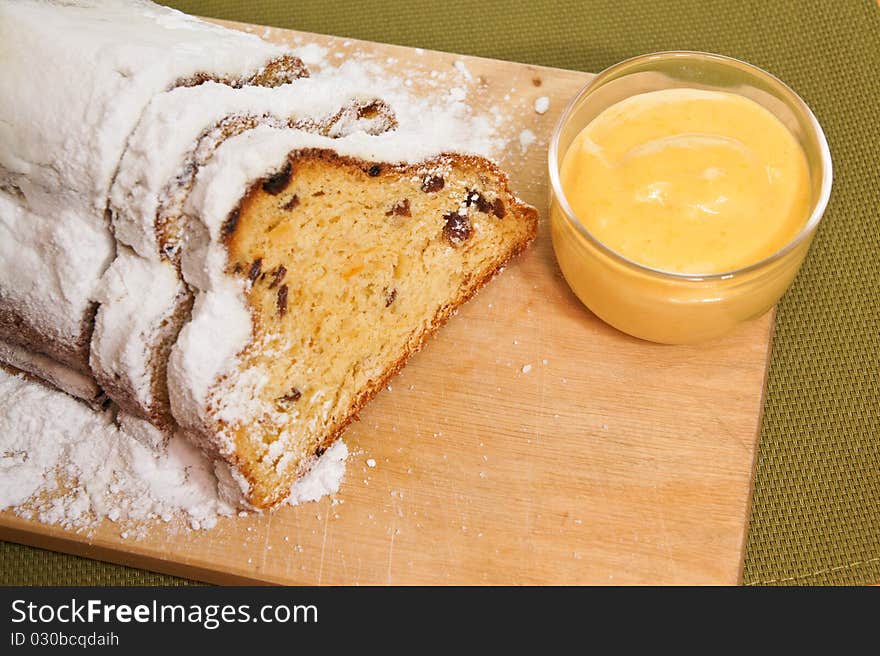 Detail on christmas stollen with egg yellow cream