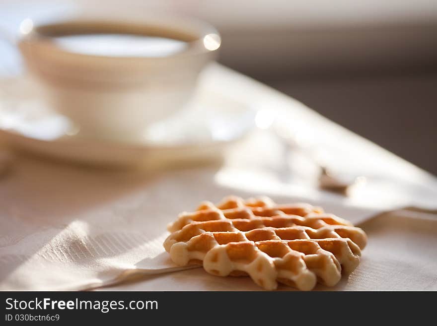 Hot coffee with wafers, close-up