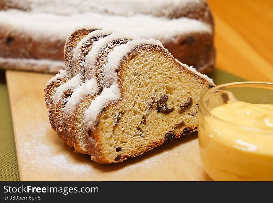 Detail on christmas stollen with egg yellow cream