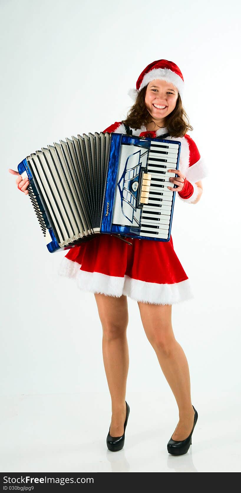 Woman santa-klaus plays for all an accordion