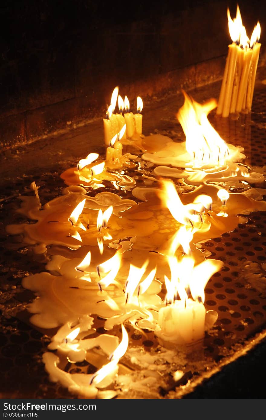 Candles burning in religious place