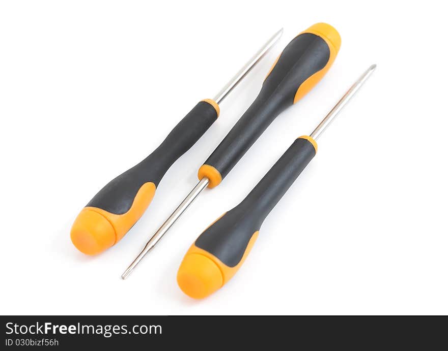 A set of three yellow and black screwdriver on a white background. A set of three yellow and black screwdriver on a white background