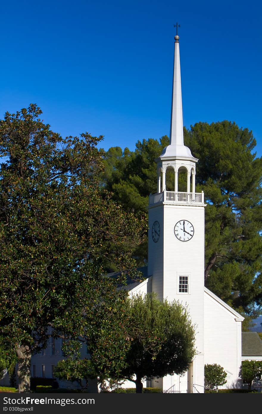 Small church with steeple in pastoral setting. Small church with steeple in pastoral setting.