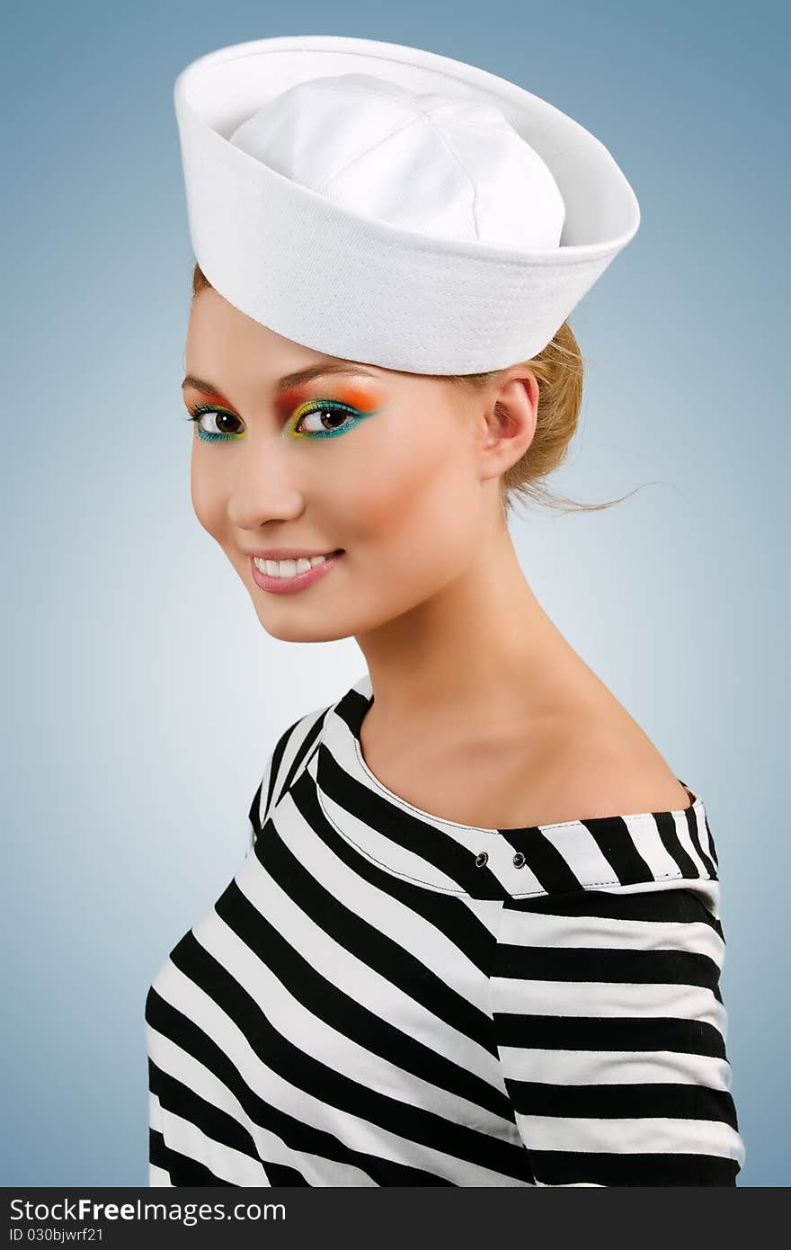 Attractive smiling young girl in sailor's cap. Attractive smiling young girl in sailor's cap