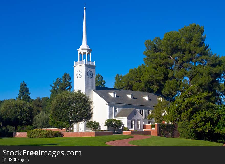 Small church with steeple in pastoral setting. Small church with steeple in pastoral setting.