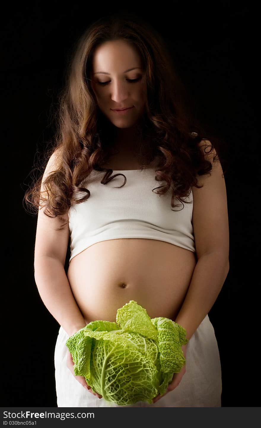 Pregnant woman with green cabbage. Pregnant woman with green cabbage