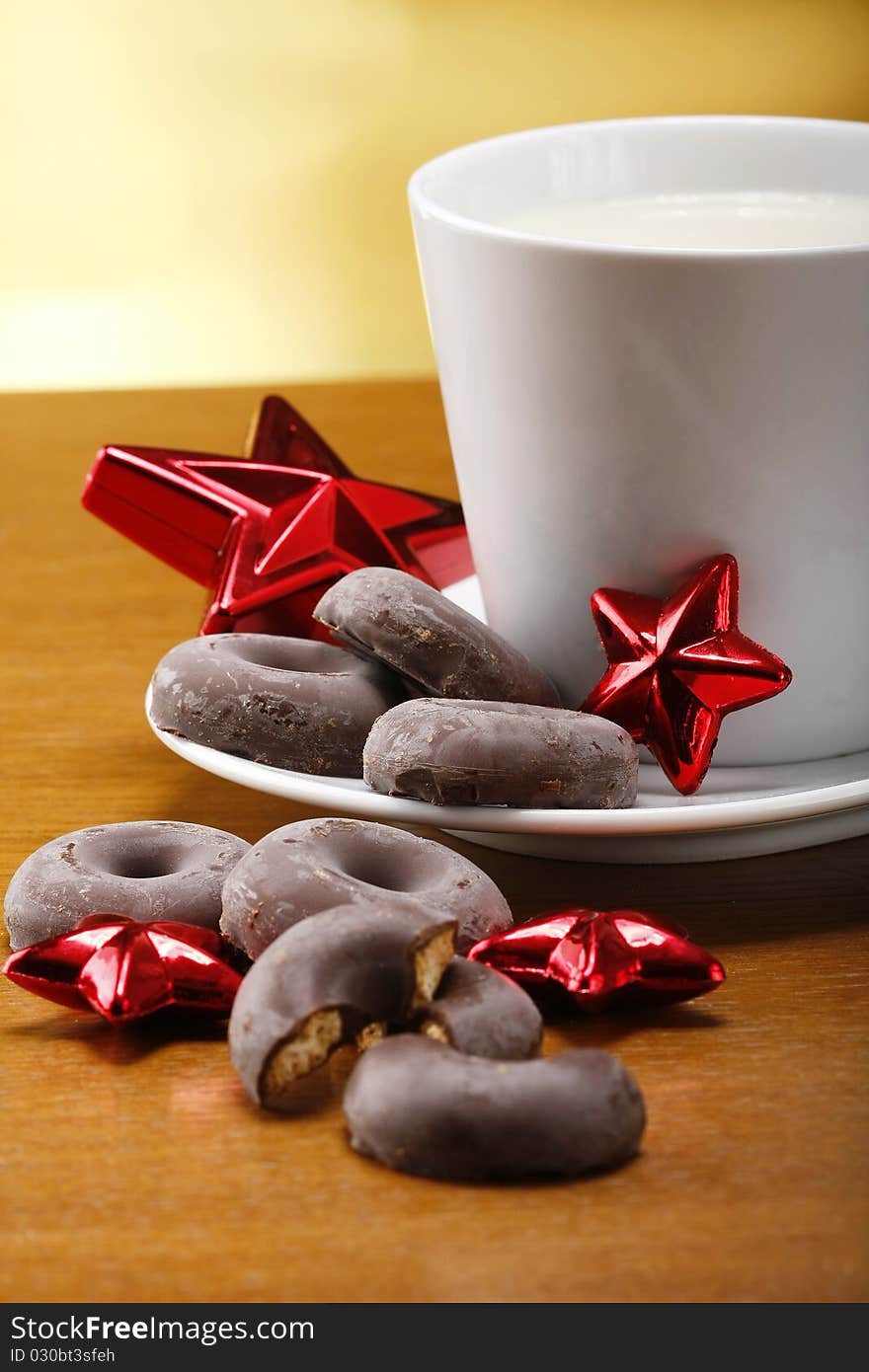 Milk and cookies for santa on table with gold background