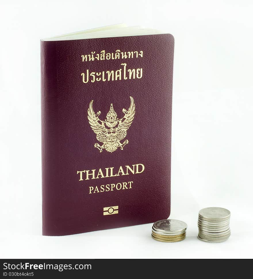 Thai passport book and thai baht coins