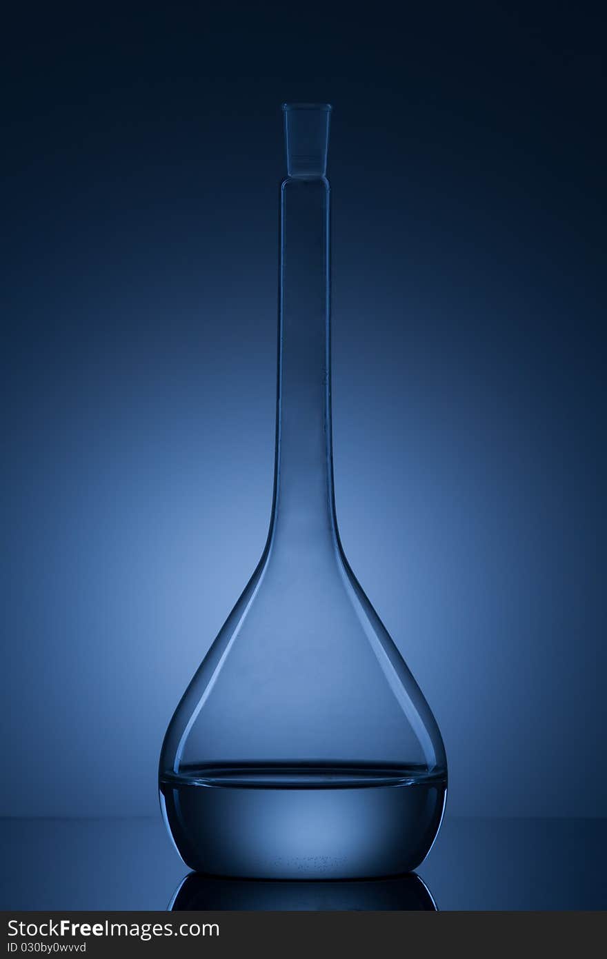 Flask with liquid and blue background