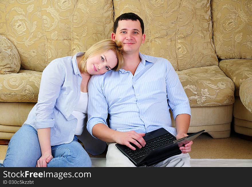 A young couple spends time together in the interior