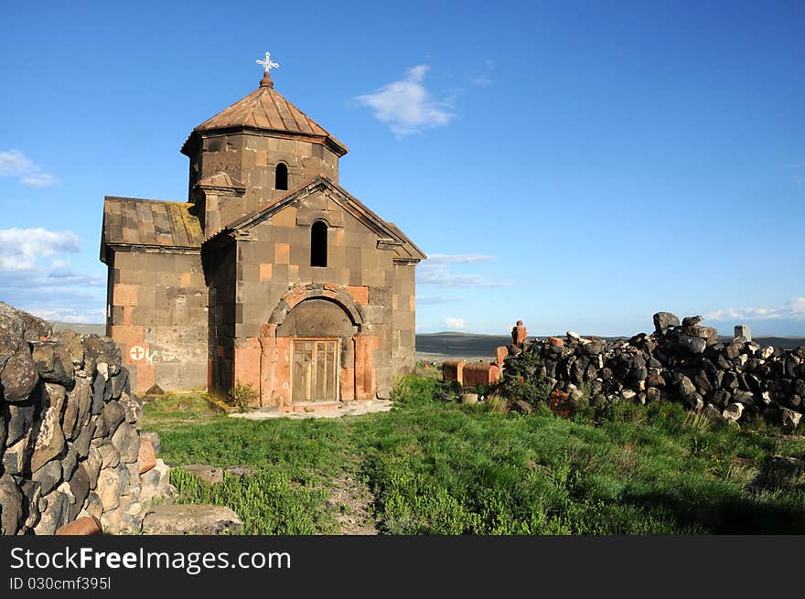 Old medieval church against blue sky background