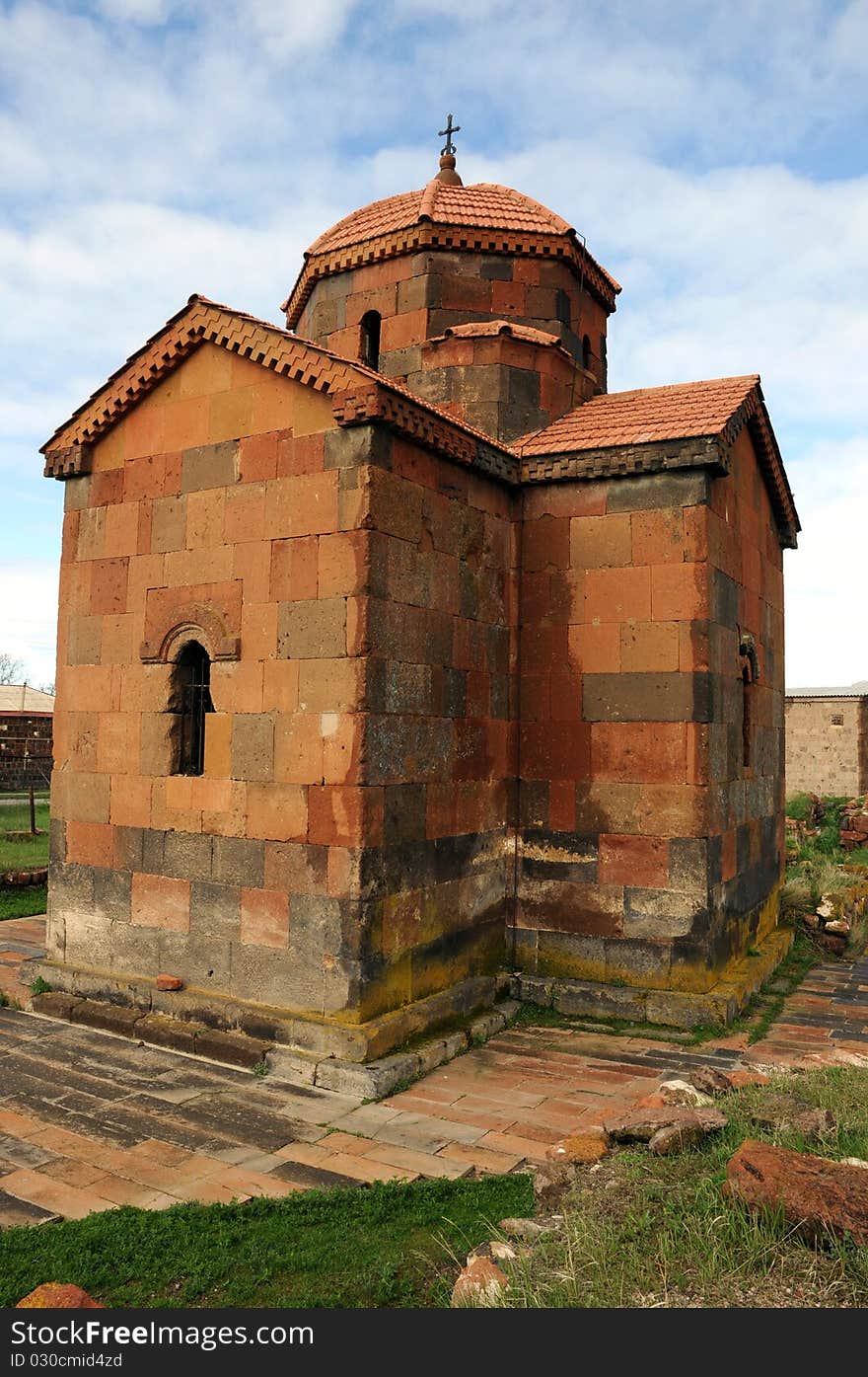 Old medieval church against blue sky background