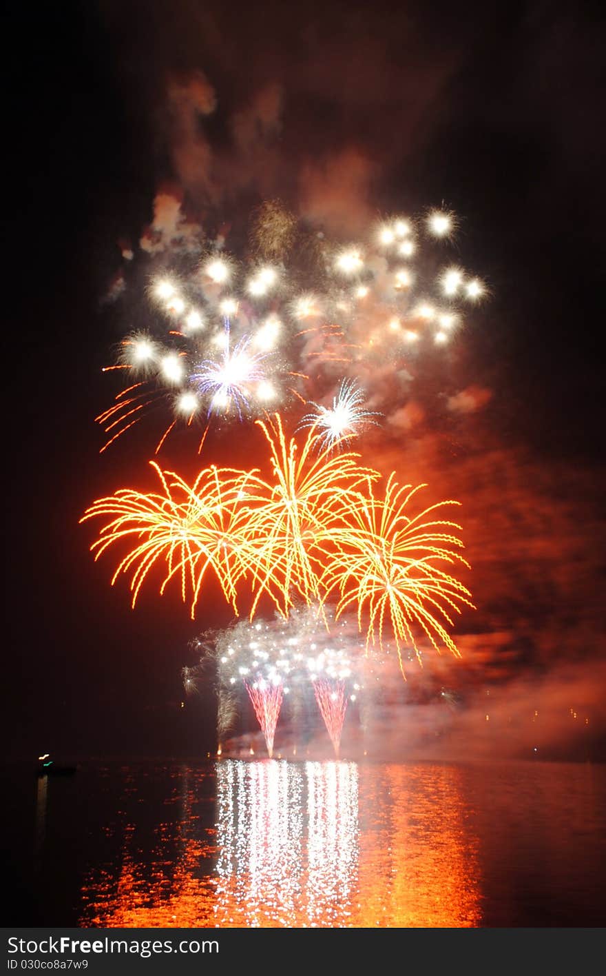 Colourful fireworks with nice reflection on the water surface.