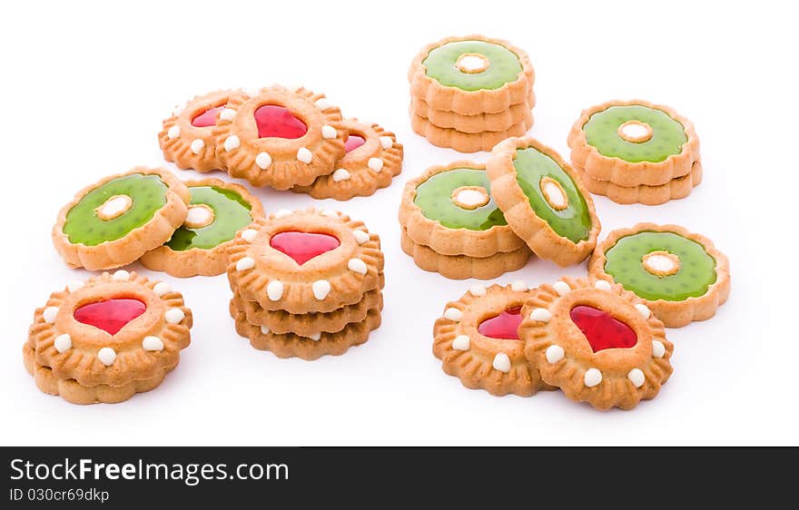 Close up shot of red and green cookies isolated on white