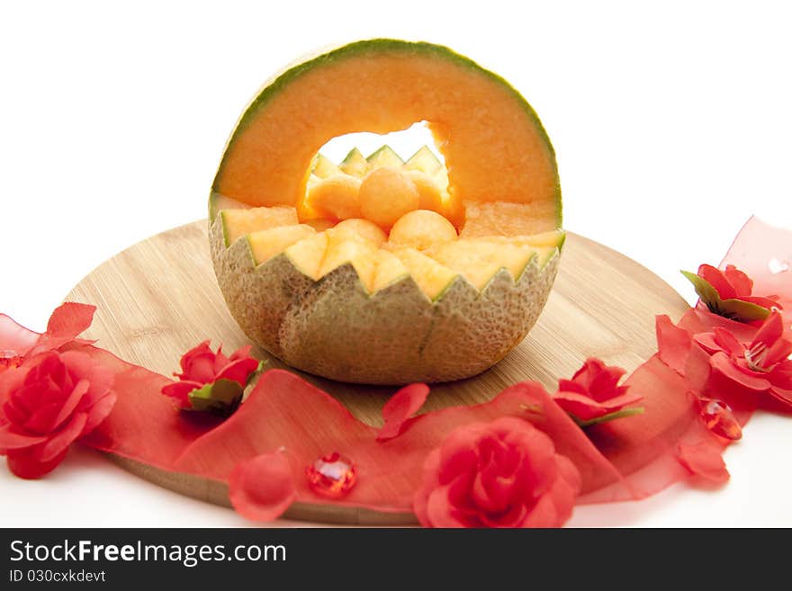 Refine melon with bow from roses