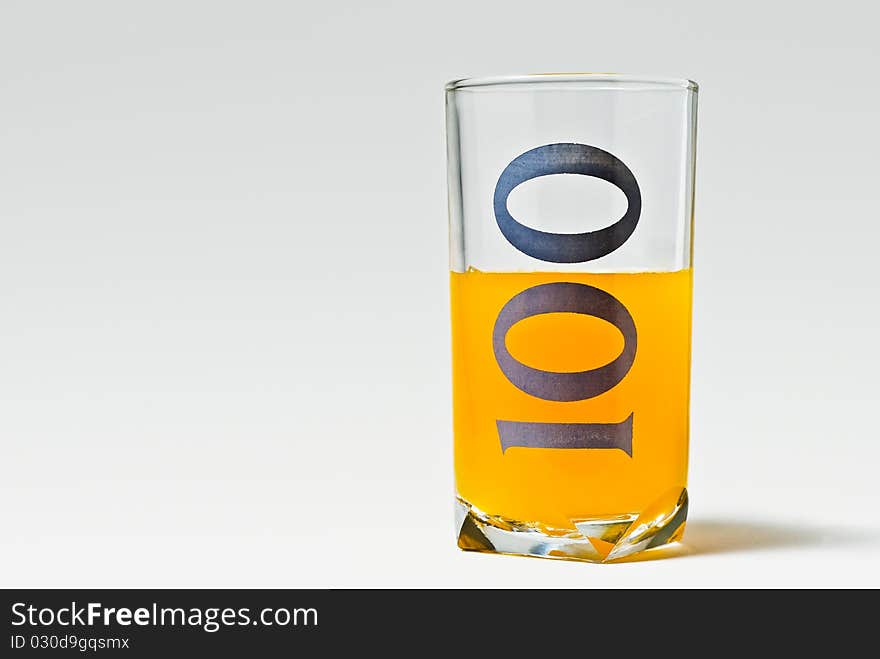 Isolated 100 glass with orange juice