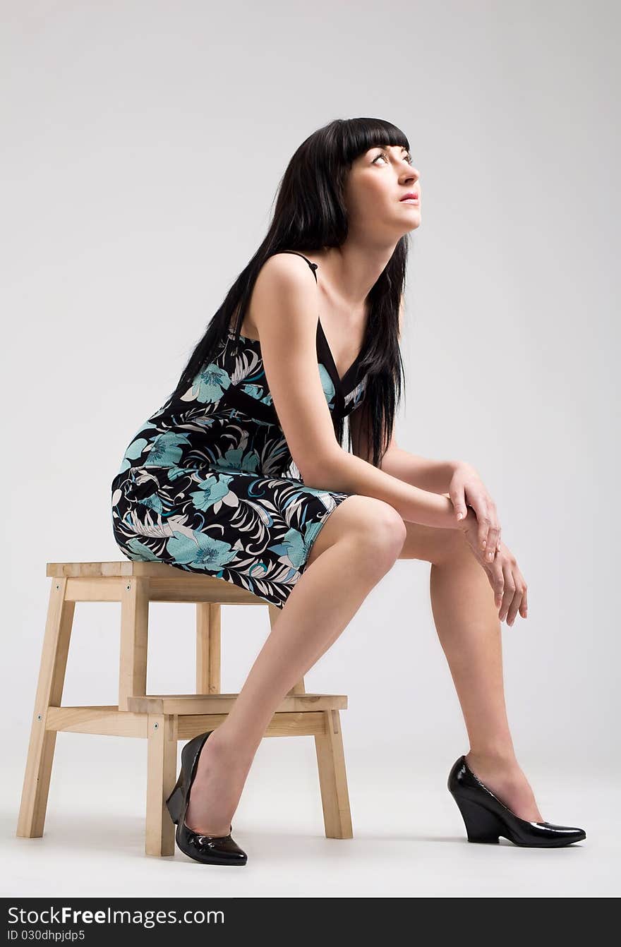 Beautiful woman sitting at the studio. Beautiful woman sitting at the studio