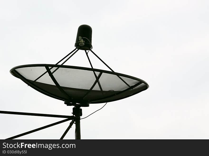 Big Black Satellite Dish isolated on White sky, home roof