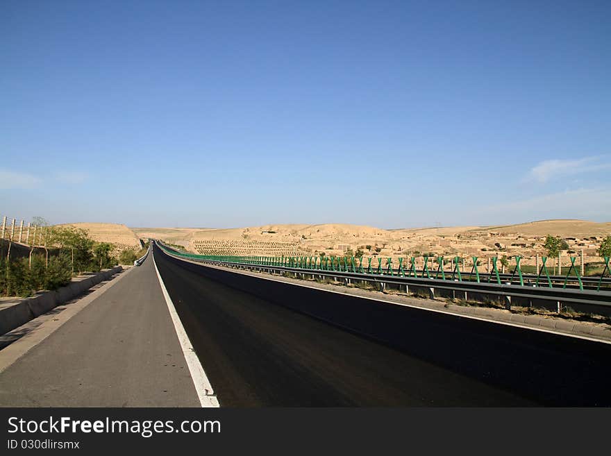 Desert Highway And Mountains At 
Northwest china