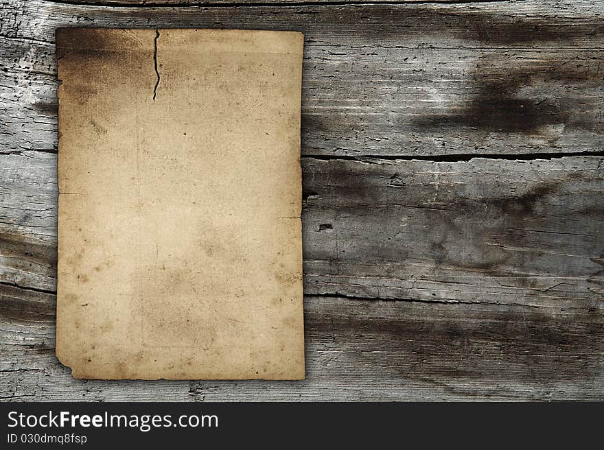 Vintage paper on old wood wall. Vintage paper on old wood wall