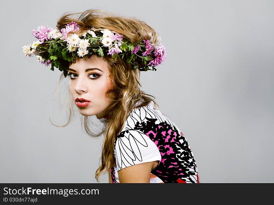 Portrait of a beautiful fashion model in flower crown. Portrait of a beautiful fashion model in flower crown