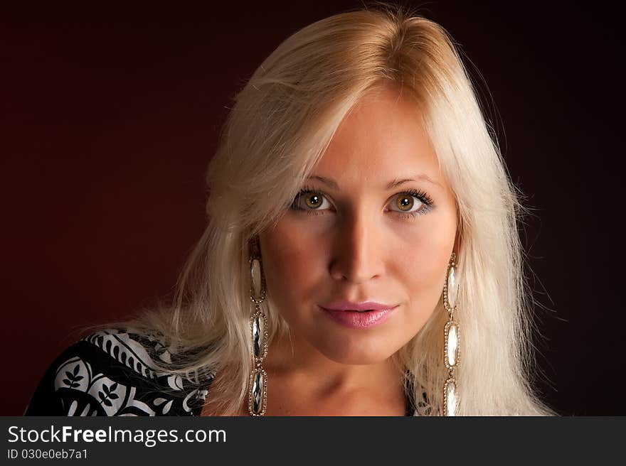 Portrait Of Beautiful young Woman. Dark background. Portrait Of Beautiful young Woman. Dark background