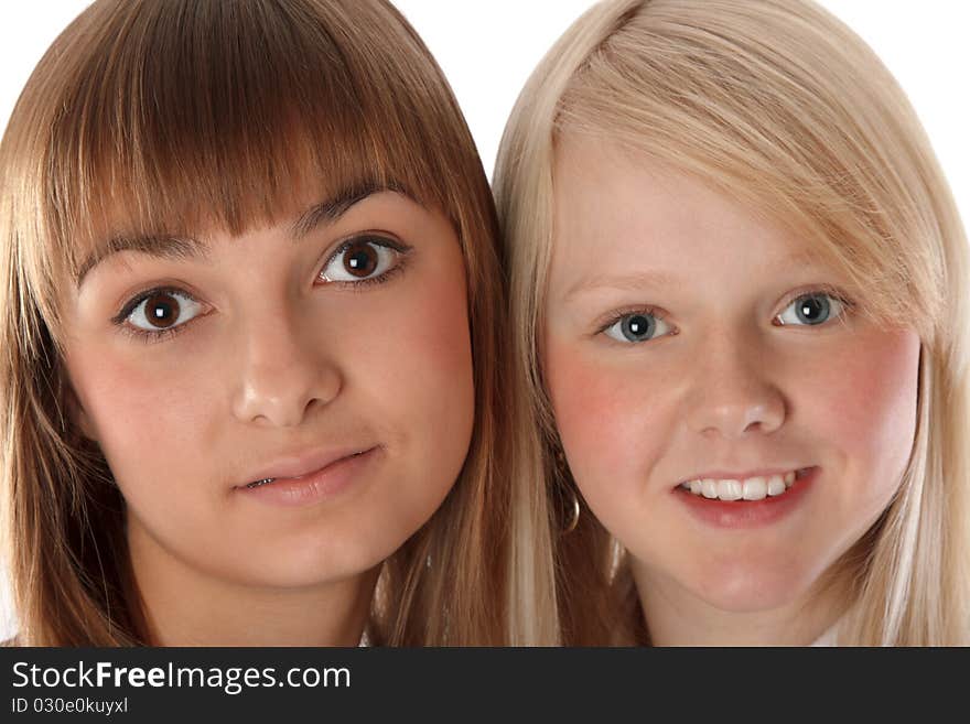 Portrait two girls of the blonde and brunettes insulated on white background