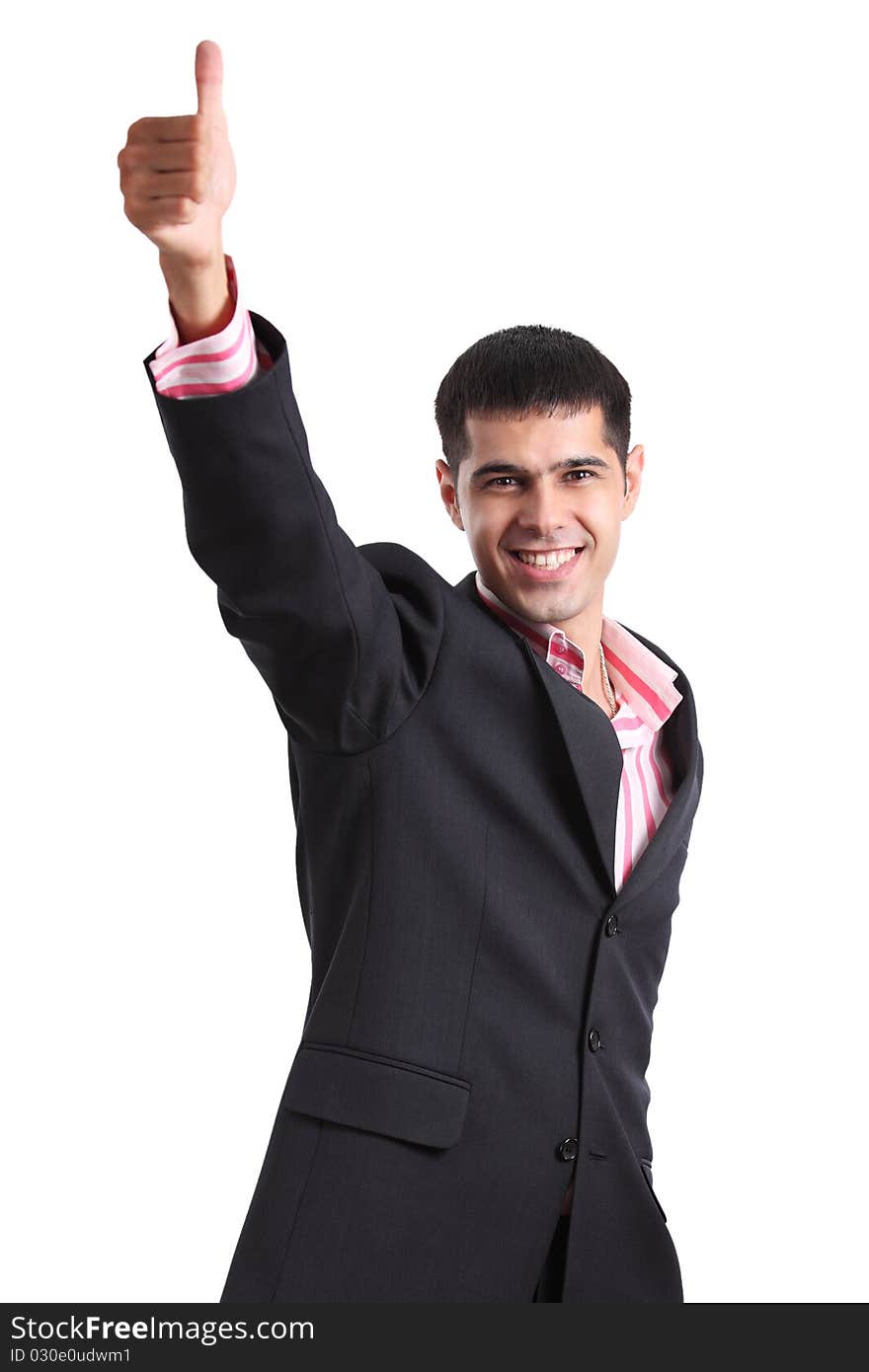 Happy young man in a business suit showing thumb up and smiling isolated on white background. Happy young man in a business suit showing thumb up and smiling isolated on white background