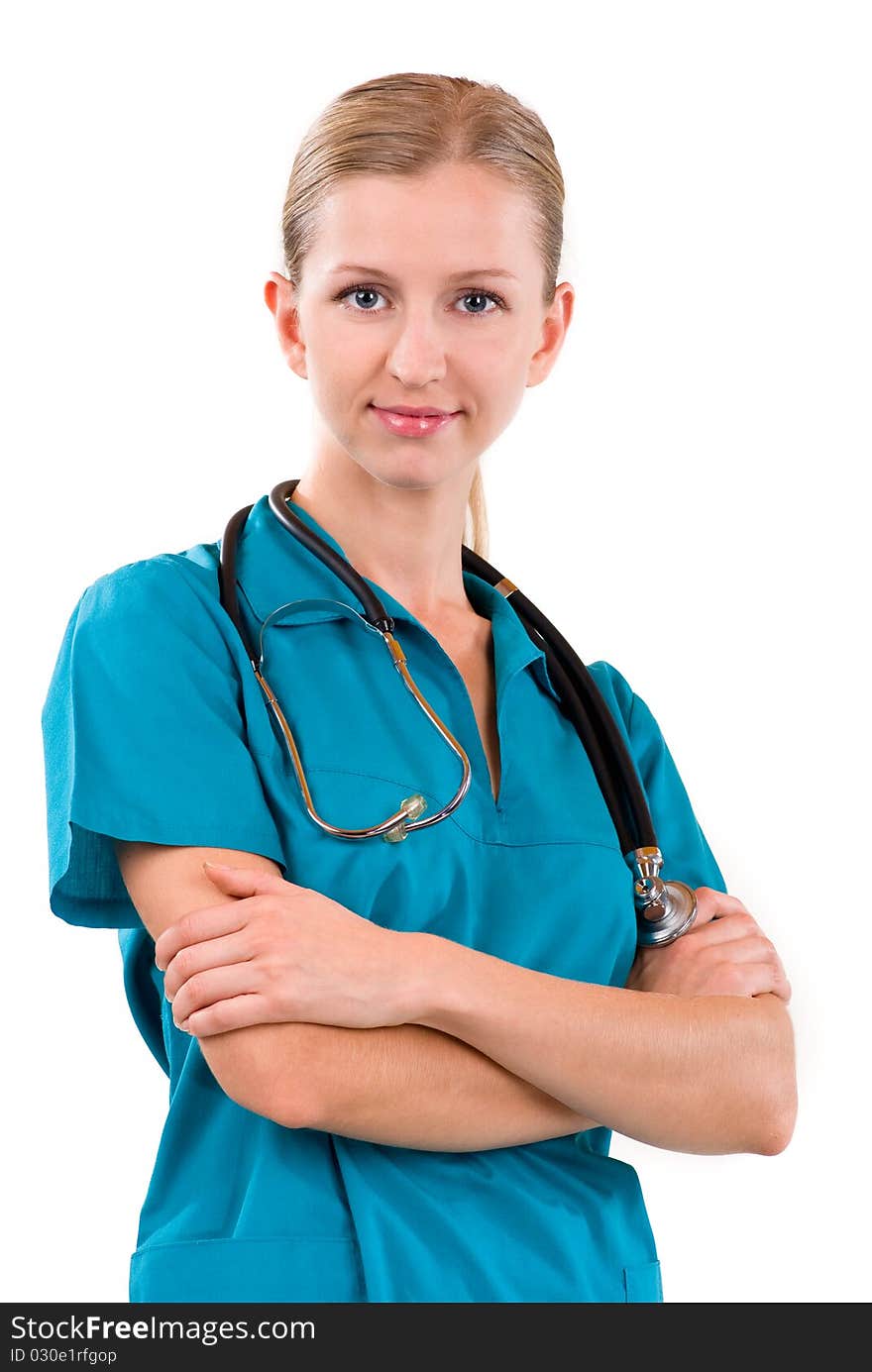 Young female doctor smiling with stethoscope; arms crossed; vertical; isolated on white. Young female doctor smiling with stethoscope; arms crossed; vertical; isolated on white