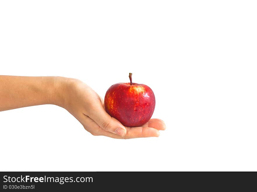 A young girl giving an apple to somebody