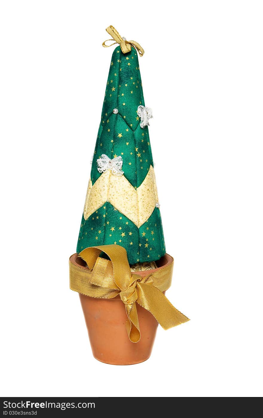 Artificial christmas green tree in brown pot with gold bow. Artificial christmas green tree in brown pot with gold bow