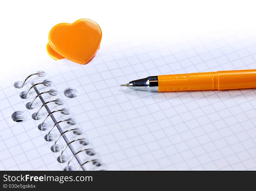 Blank note book with pen and Heart shaped clip. Blank note book with pen and Heart shaped clip