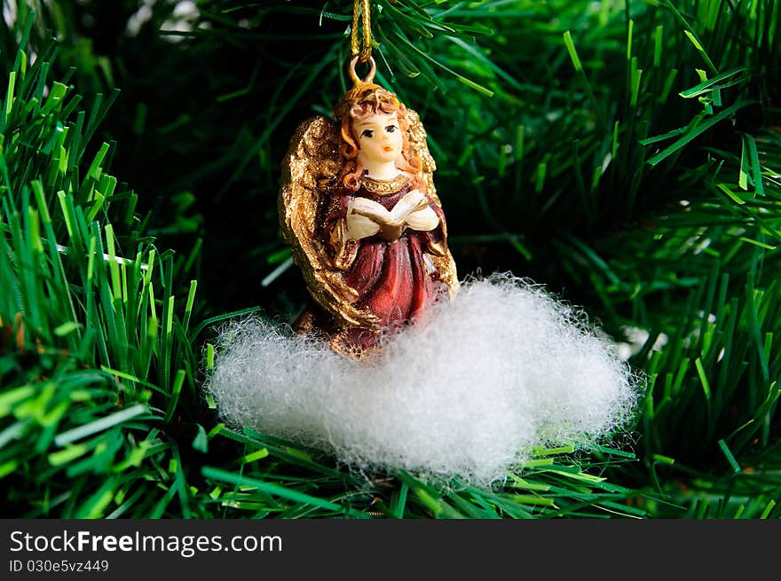 Angel on cloud - Christmas tree decoration on xmas green tre