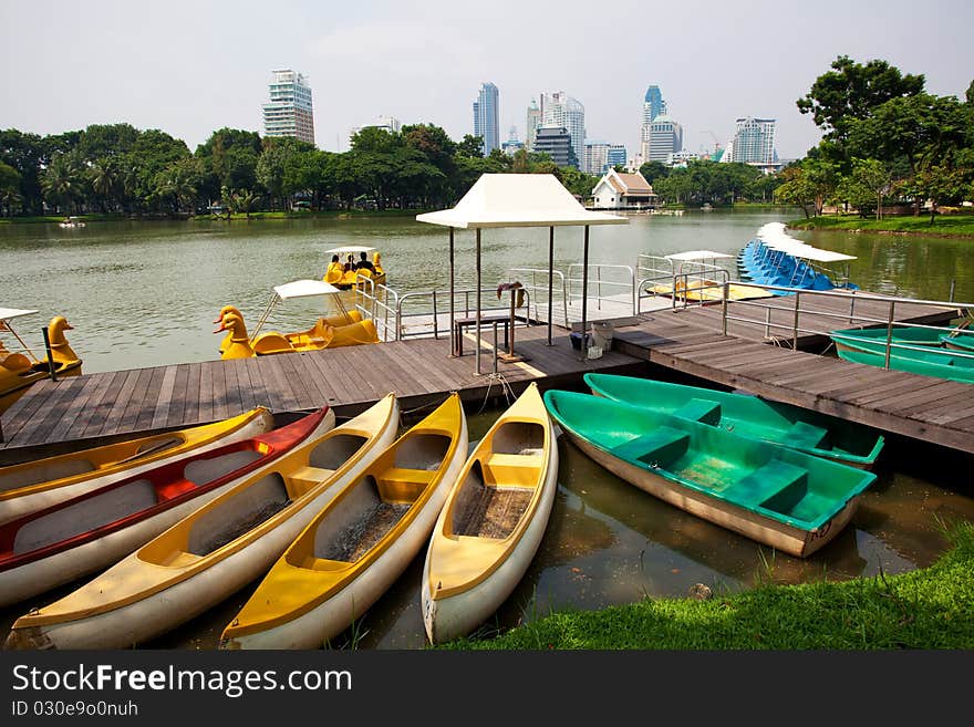 Paddle boat on lake in city